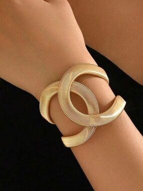 Gold Tone Sculptural Interlocking C Bracelet